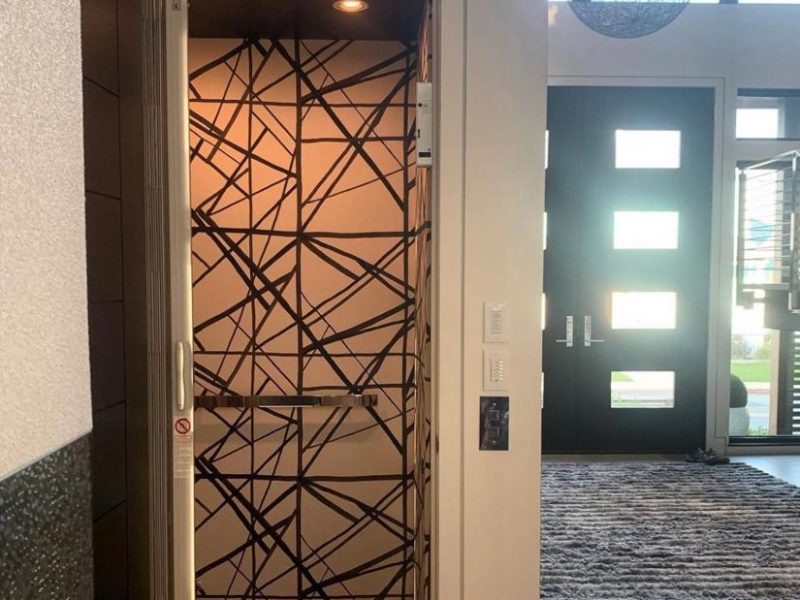Custom elevator installation with an architectural patterned cab